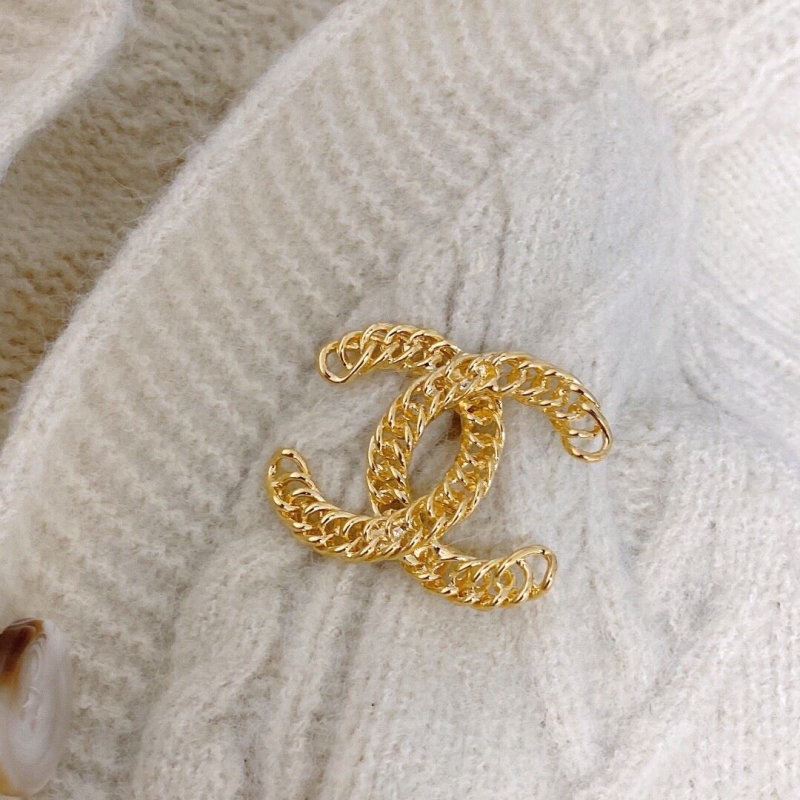 Ch*el brooches